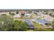 Aerial view of a quiet residential neighborhood with houses and lush green landscape at 2123 Barbosa Ct, The Villages, FL 32159