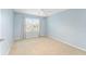 Light blue bedroom with carpet flooring and a ceiling fan at 2123 Barbosa Ct, The Villages, FL 32159