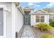 Front entryway with a teal door and a flagstone walkway at 2123 Barbosa Ct, The Villages, FL 32159