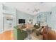 Bright living room with hardwood floors and a view into the kitchen at 2123 Barbosa Ct, The Villages, FL 32159