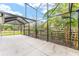 Screened patio with lush landscaping and backyard view at 2123 Barbosa Ct, The Villages, FL 32159