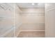 Large walk-in closet with wire shelving for ample storage at 2123 Barbosa Ct, The Villages, FL 32159