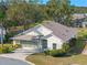 Aerial view of single-Gathering home with a two-car garage at 21509 Castle View Ct, Leesburg, FL 34748