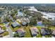 Aerial view of a single Gathering home near a pond and golf course at 21509 Castle View Ct, Leesburg, FL 34748