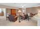 Living room with brown leather furniture and built-in shelving at 21509 Castle View Ct, Leesburg, FL 34748