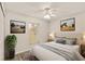 Cozy bedroom with a comfortable bed, stylish decor, and a bright window view at 21721 Loch Haven Pass, Leesburg, FL 34748