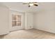 Bright bedroom with carpeted floors and ceiling fan at 21721 Loch Haven Pass, Leesburg, FL 34748