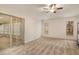 Spacious bedroom with neutral carpet, large windows, and a sliding glass door at 21721 Loch Haven Pass, Leesburg, FL 34748