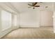 Bright living room featuring neutral decor and carpet at 21721 Loch Haven Pass, Leesburg, FL 34748