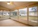 Bright sunroom with view of backyard and ceiling fan at 21721 Loch Haven Pass, Leesburg, FL 34748