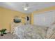 Bedroom with dresser, TV, and double bed at 2214 Quinn Ln, The Villages, FL 32162