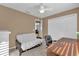 Bedroom with a desk, futon, and double door closet at 2214 Quinn Ln, The Villages, FL 32162