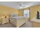 Bright bedroom with a queen-size bed and ceiling fan at 2214 Quinn Ln, The Villages, FL 32162