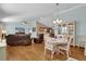 Dining room with hardwood floors and a white table at 2214 Quinn Ln, The Villages, FL 32162