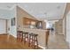 Kitchen with light wood cabinets and an island at 2214 Quinn Ln, The Villages, FL 32162