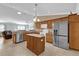 Modern kitchen with stainless steel appliances and island at 2214 Quinn Ln, The Villages, FL 32162