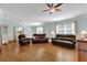 Living Room with hardwood floors and leather couches at 2214 Quinn Ln, The Villages, FL 32162