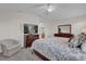 Large main bedroom with king-size bed and en-suite bathroom at 2214 Quinn Ln, The Villages, FL 32162