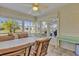 Sunroom with table and chairs, offering plenty of natural light at 2214 Quinn Ln, The Villages, FL 32162