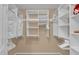 Large walk-in closet with plenty of shelving and hanging space at 2214 Quinn Ln, The Villages, FL 32162