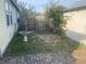 Small backyard with brick patio, bird bath, and some plants at 2315 Thelma Ave, Haines City, FL 33844