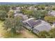 Aerial view of a house and community with golf course at 2334 Fenton Ave, Clermont, FL 34711