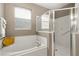 Bathroom with bathtub and walk-in shower at 2334 Fenton Ave, Clermont, FL 34711