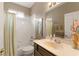 Clean bathroom with shower/tub combo and updated vanity at 2334 Fenton Ave, Clermont, FL 34711