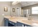 Bathroom with double vanity,beige countertop and blue cabinets at 2334 Fenton Ave, Clermont, FL 34711