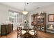 Charming dining area with a glass table and wood chairs at 2334 Fenton Ave, Clermont, FL 34711