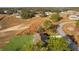 Aerial view of a house and surrounding area, showing lot size and neighborhood context at 238 Oak Lane Cir, Ocala, FL 34472