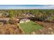 Aerial view of a house with a large backyard and surrounding nature at 238 Oak Lane Cir, Ocala, FL 34472