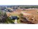 Aerial view of a single-story house with a large lot and surrounding landscape at 238 Oak Lane Cir, Ocala, FL 34472