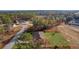 Aerial view showing a house on a lot with a paved driveway at 238 Oak Lane Cir, Ocala, FL 34472