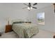 Cozy bedroom with a queen-size bed and window coverings at 238 Oak Lane Cir, Ocala, FL 34472