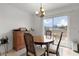 Bright dining area with sliding glass doors leading to a backyard view at 238 Oak Lane Cir, Ocala, FL 34472