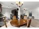 Charming dining room with a round wooden table and four chairs at 238 Oak Lane Cir, Ocala, FL 34472