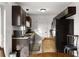 Bright kitchen with dark wood cabinets and granite countertops at 238 Oak Lane Cir, Ocala, FL 34472