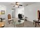 Relaxing living room with a glass coffee table and comfortable seating at 238 Oak Lane Cir, Ocala, FL 34472