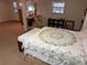 Basement bedroom with large bed and access to other rooms at 2403 County Road 416N, Lake Panasoffkee, FL 33538