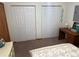 Bedroom with double bed and closets at 2403 County Road 416N, Lake Panasoffkee, FL 33538