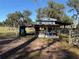 Chicken coop with attached shelter and fenced run at 2403 County Road 416N, Lake Panasoffkee, FL 33538