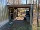 Exterior view of a chicken coop with a covered area at 2403 County Road 416N, Lake Panasoffkee, FL 33538