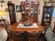 Spacious dining room featuring a large wooden table and chairs at 2403 County Road 416N, Lake Panasoffkee, FL 33538