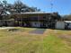 Elevated home with large yard and detached shed at 2403 County Road 416N, Lake Panasoffkee, FL 33538