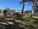 Ranch style home on spacious lot with mature trees and a large yard at 2403 County Road 416N, Lake Panasoffkee, FL 33538