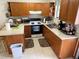 Galley kitchen with ample counter space at 2403 County Road 416N, Lake Panasoffkee, FL 33538