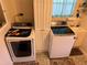 Bright laundry room with Samsung washer and dryer at 2403 County Road 416N, Lake Panasoffkee, FL 33538