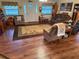 Spacious living room with wood floors and comfortable seating at 2403 County Road 416N, Lake Panasoffkee, FL 33538