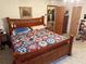 Main bedroom with king-size bed and access to a full bathroom at 2403 County Road 416N, Lake Panasoffkee, FL 33538